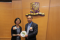 Prof. Wong Suk-ying (right), Associate-Vice-President of CUHK, presents a souvenir to Mr. Zhang Zongming, Deputy Inspector of the Department of Educational, Scientific and Technological Affairs, Liaison Office of the Central People's Government in the HKSAR